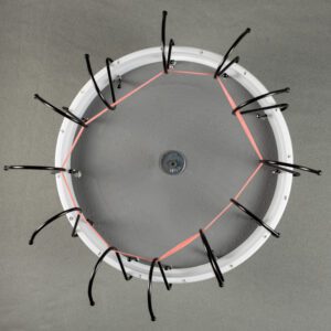 Round frame with black clips and red bands